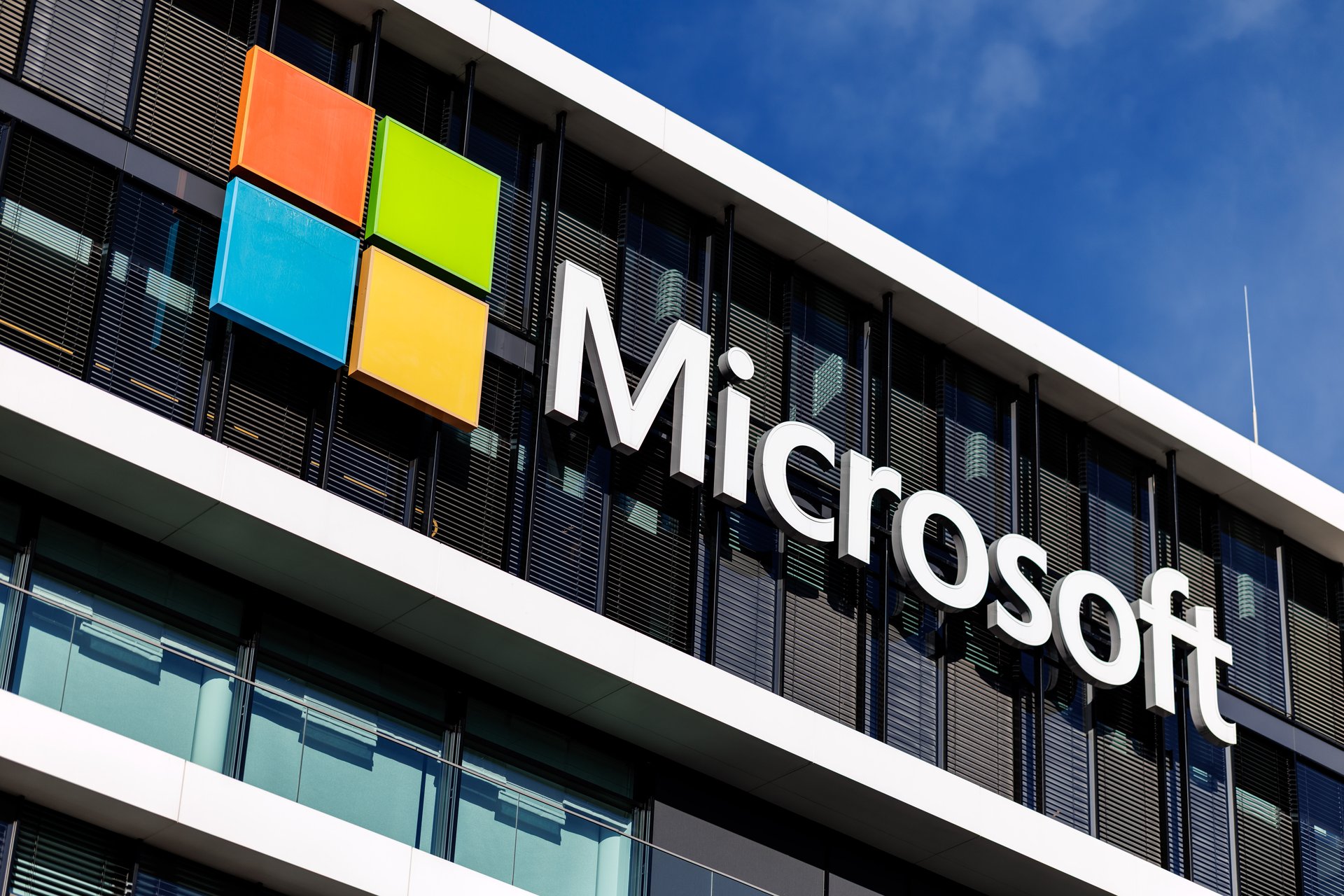 Microsoft logo on a corporate office building, representing Microsoft security updates and Windows vulnerability response.