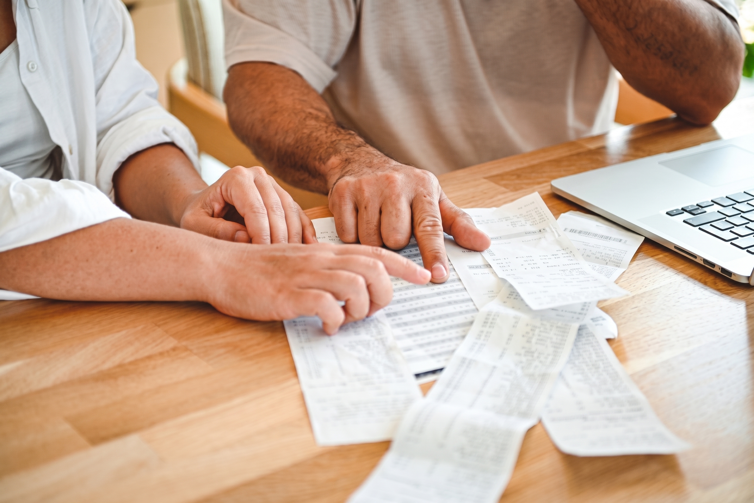 Business expenses and financial documents representing the financial consequences of social engineering fraud.