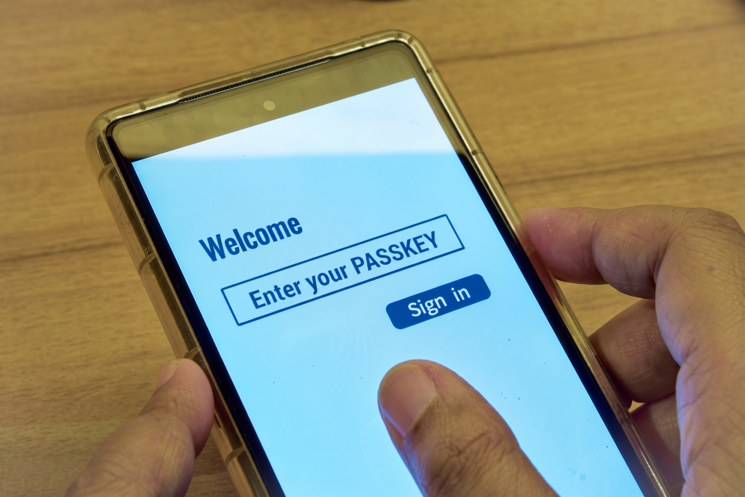 User signing in with a passkey on a smartphone